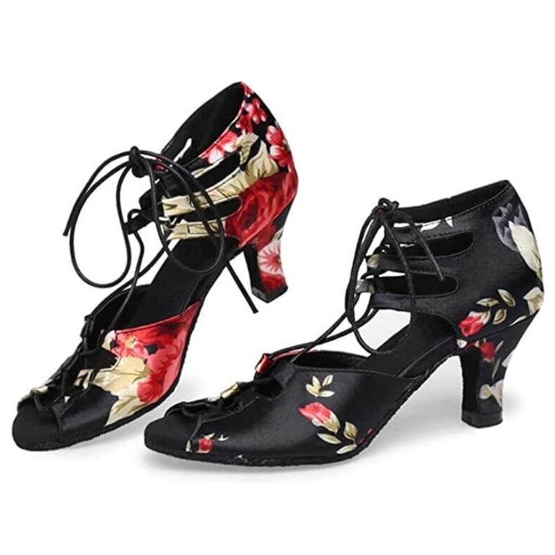 pair of black satin lace-up latin dance boots for women with a red and cream floral print heel counter and peep toe