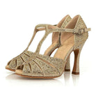 pair of gold glitter dance shoes for women with rhinestone t-strap upper and peep toe