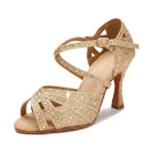 Gold rhinestone latin dance shoes side view, open toe salsa heels with crystal paved vamp, flared heel and crossed ankle strap