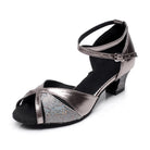 pewter metallic latin dance shoe for women with a glitter panel at the vamp, crossed ankle strap and a low block heel