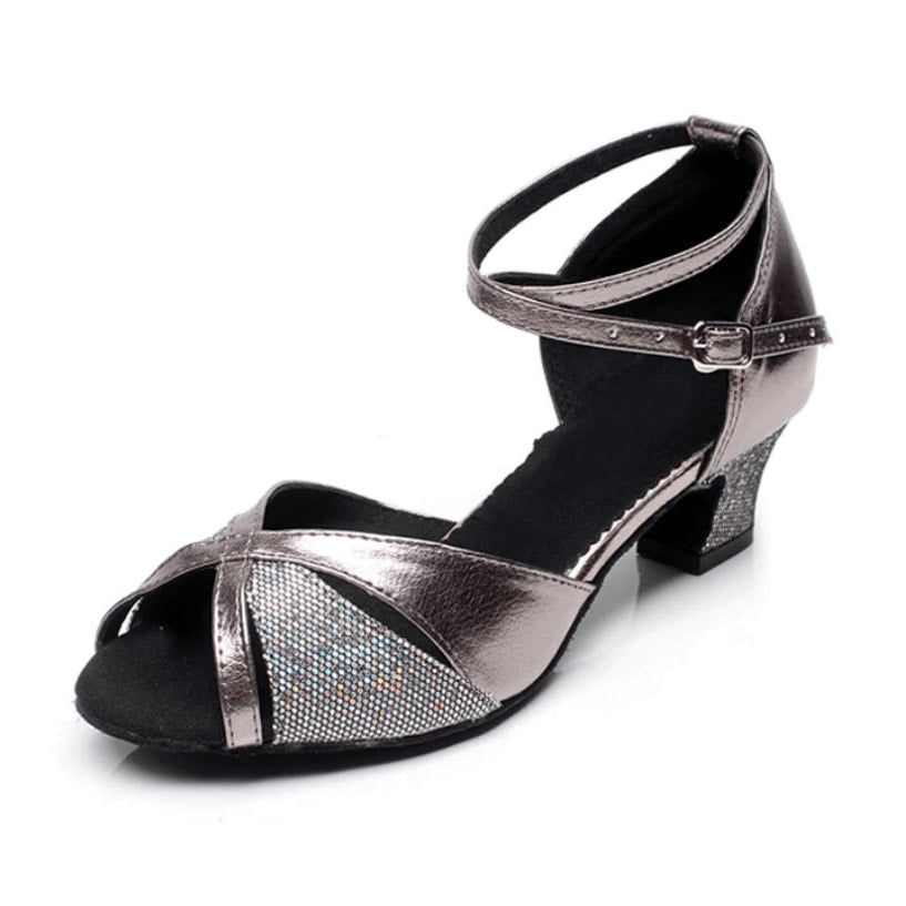 pewter metallic latin dance shoe for women with a glitter panel at the vamp, crossed ankle strap and a low block heel