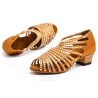pair of tan satin beginner dance shoes for women with low block heel and rhinestone-lined straps