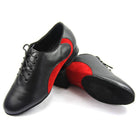 pair of men's black leather latin dance shoes with a red suede heel counter and a low block cuban heel
