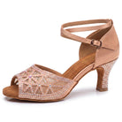 Nude satin latin dance shoes side view, mesh vamp traced in clear rhinestones, crystal faced flared heel and crossed ankle strap