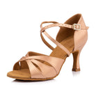 Nude satin latin dance shoe for women side view, open toe salsa heel with petal cut-outs, criss-cross ankle strap and rhinestone buckle