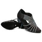 pair of black rhinestone ballroom dance shoes for women, one turned showing the sole and heel