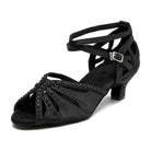 black satin salsa dance shoe for women with black rhinestone straps and low flared heel