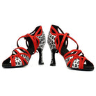 pair of leopard print latin dance shoes for women with red crossed toe straps, red ankle strap and a flared heel