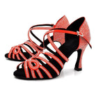 pair of red rhinestone salsa dance shoes for women with crystal-lined straps on black lining