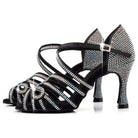 pair of black rhinestone latin dance shoes for women with crystal swirl heel counter and open toe