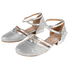 Silver glitter ballroom dance shoes pair, closed round toe with twin metallic instep straps, crossed ankle strap and low block heel