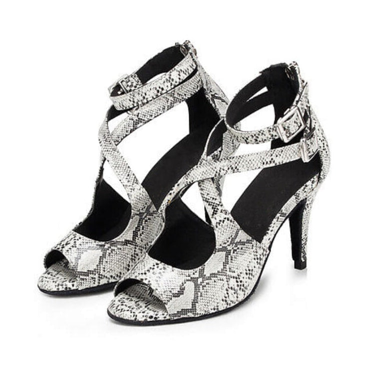 pair of snakeskin print latin dance shoes for women with crossed cutout side straps, buckled ankle strap and stiletto heel