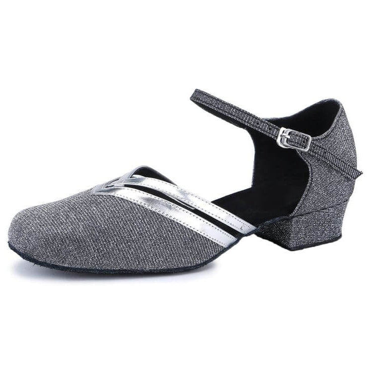 grey closed-toe ballroom dance shoe with silver metallic trim, ankle strap, low cuban heel