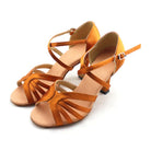 pair of tan satin latin dance shoes for women with fanned multi-strand toe straps, crossed ankle strap and a low block heel