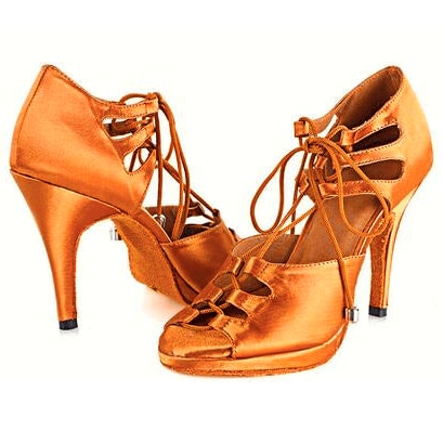 pair of tan satin lace-up samba platform dance shoes for women with cutout side panels and tall stiletto heels