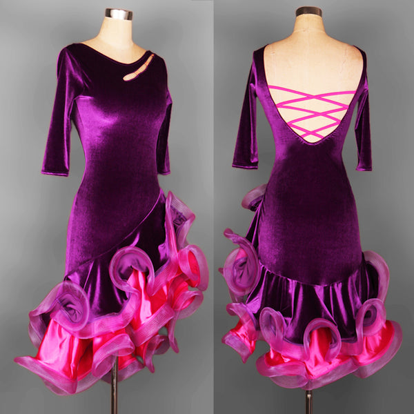 Purple velvet latin dance dress front view with slashed shoulder opening and pink ruffle hem