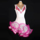 White latin dance dress with pink floral applique at the neckline and pink curled ruffle skirt