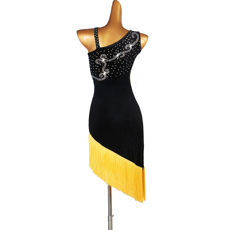 Black latin dance dress with yellow fringe seen from the side showing the asymmetric straps
