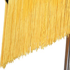 Close view of the yellow tassel fringe on the diagonal hem