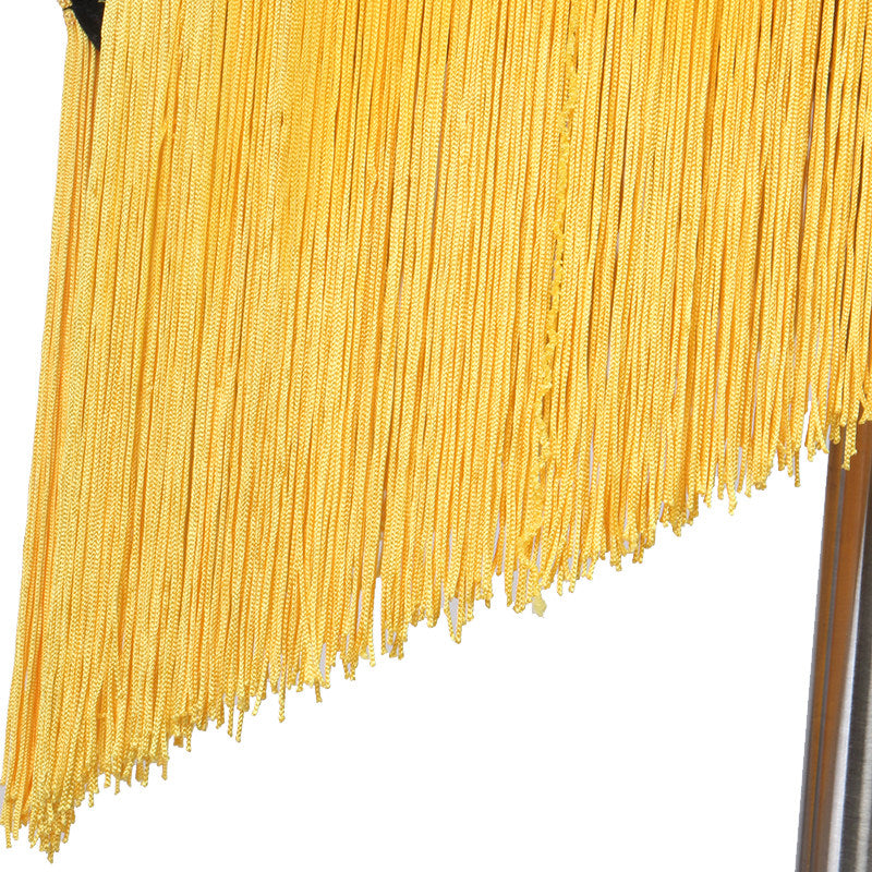 Close view of the yellow tassel fringe on the diagonal hem