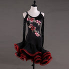 Black latin dance dress with embroidered roses climbing the bodice and a red curled ruffle skirt
