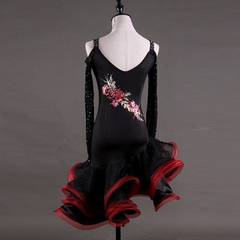 Black latin dance dress rear view showing the cold shoulder cutouts and stoned mesh sleeves