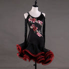 Black latin dance dress angled view with the rose embroidery and red organza layers
