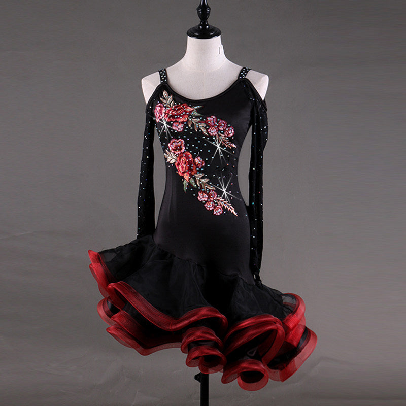 Black latin dance dress side view showing the red and black ruffle hem