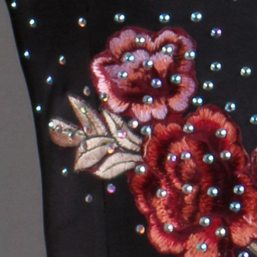 Close view of the raised rose embroidery ringed with rhinestones