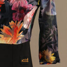 Close view of the painterly floral print fabric and the half sleeve