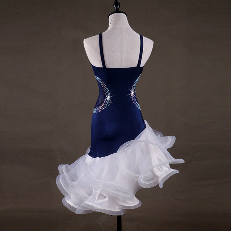 Navy velvet latin dance dress front view with the white ruffle skirt spread