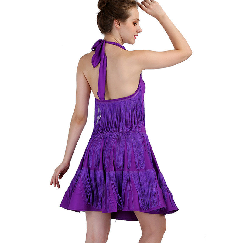 Model showing the open back of the purple crinkle latin dance dress