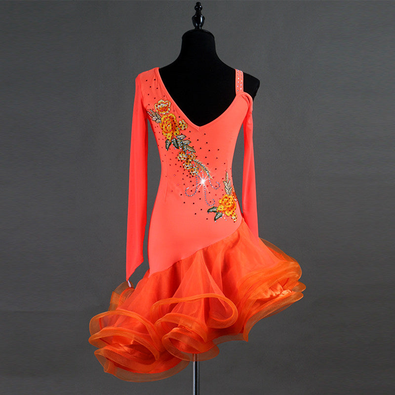 Orange latin dance dress angled view with the embroidered bodice panel