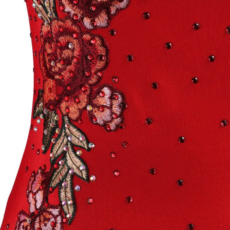 Close view of the raised gold and rose embroidery set with rhinestones