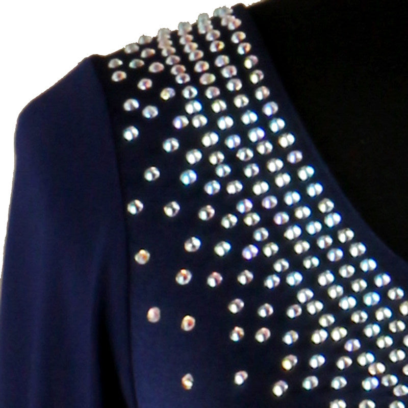 Close view of the densely set crystals on the navy shoulder