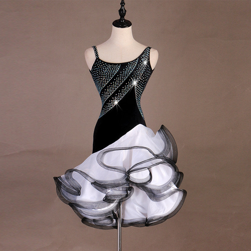 Black velvet latin dance dress with diagonal crystal band and white curled organza skirt
