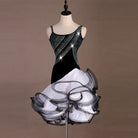 Black velvet latin dance dress angled view showing the crystal band and white ruffles