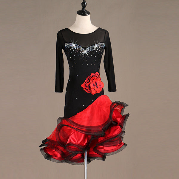 Black latin dance dress with crystal sweetheart bodice, red rose corsage and red ruffle skirt