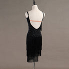 Black latin dance dress rear view showing the open back and fringe hem