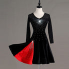 Black latin dance dress with red godet panels flaring from the skirt seams