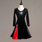 Black latin dance dress angled view with the red godet panel opening