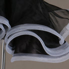 Close view of the contrast edged organza ruffle layers
