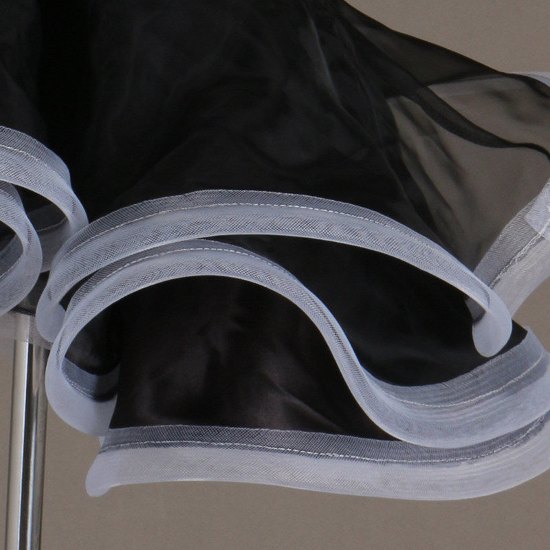 Close view of the contrast edged organza ruffle layers