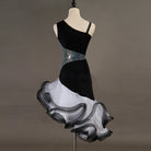 Black one shoulder latin dance dress angled view showing the grey and white organza curls