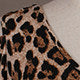 Close view of the leopard print fabric and half sleeve