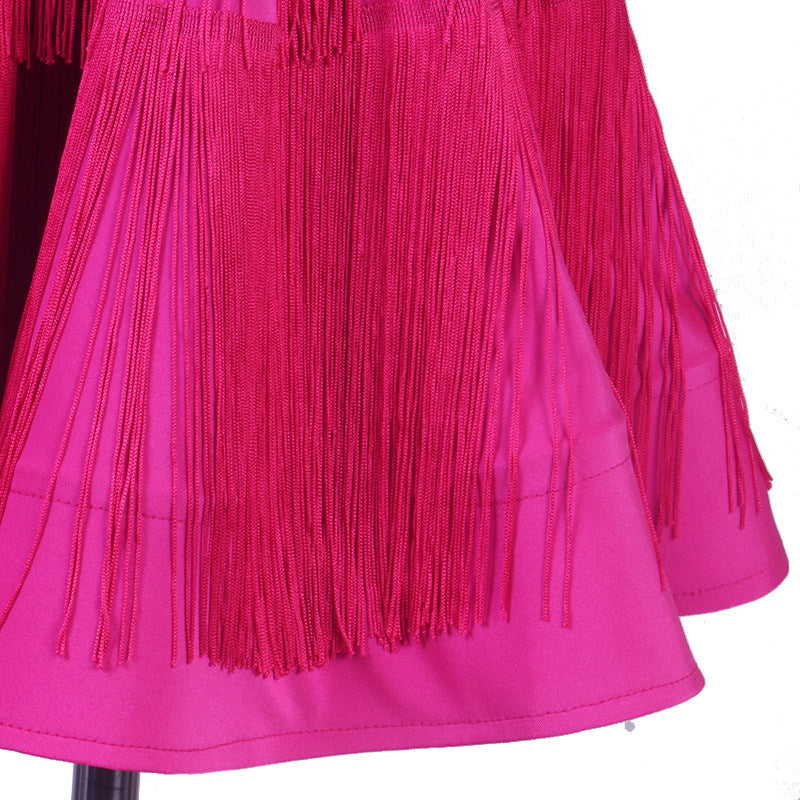 Close view of the finely pleated skirt and fringe edge