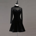 Black velvet latin dance dress front view with the flared ruffle hem