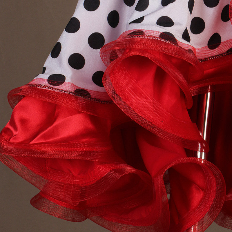 Close view of the red curled organza ruffle layers on polka dot