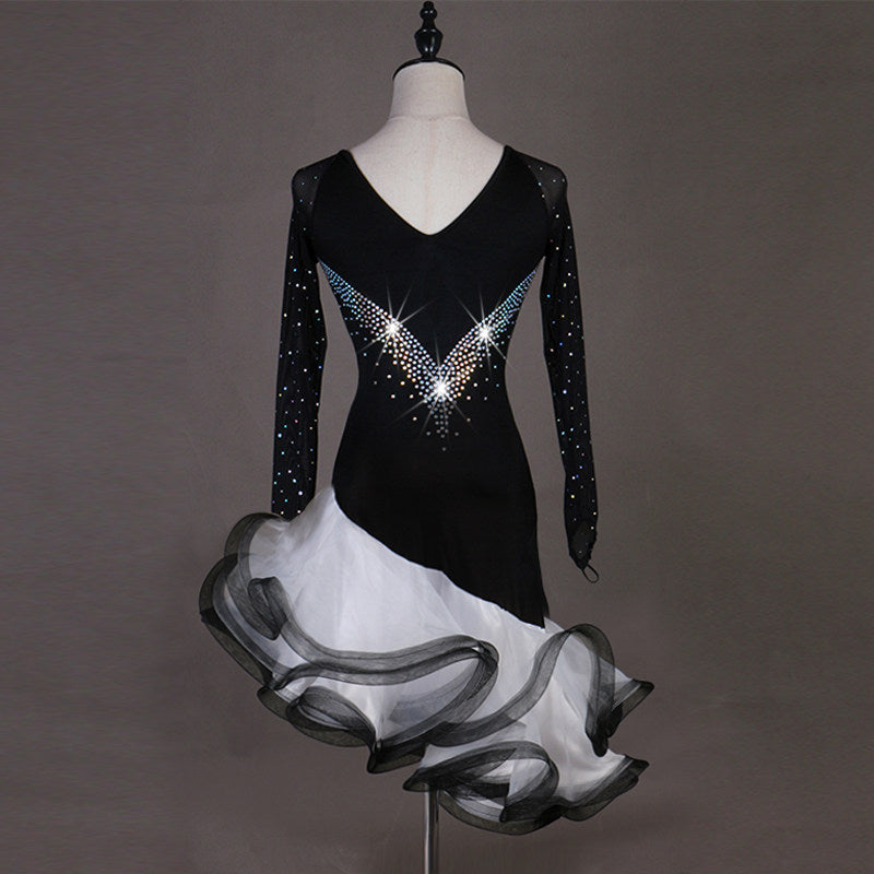 Black latin dance dress rear view showing the V back and ruffle skirt
