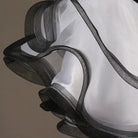 Close view of the white organza ruffle edged in black